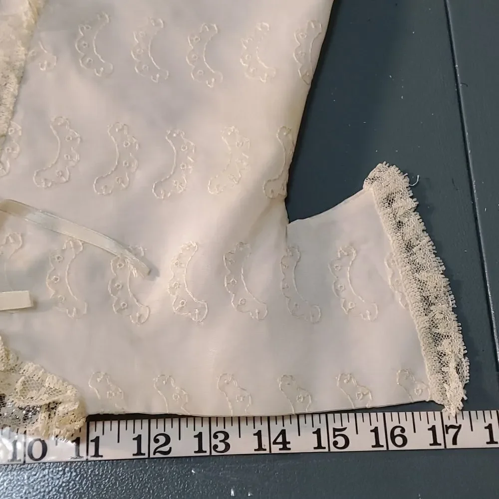 Vintage baby dress with jacket. Trimmed in lace with tie. The jacket has enbroid